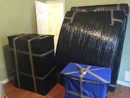 Furniture wrapped in protective material before moving