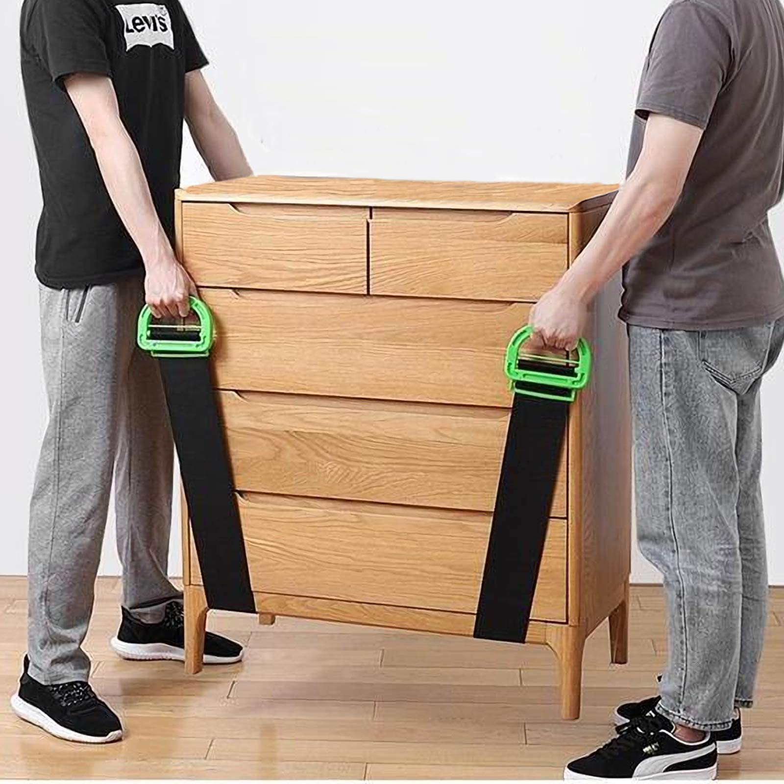 Movers carefully carrying a heavy sofa